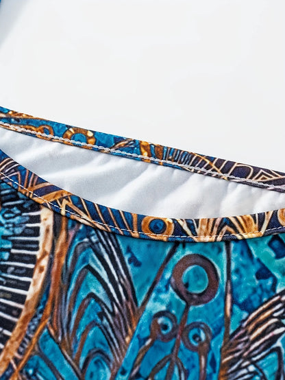 Bohemian-inspired maxi dress featuring a vibrant blue-and-gold totem print. Halter-neck, sleeveless cut with a slim fit and flow